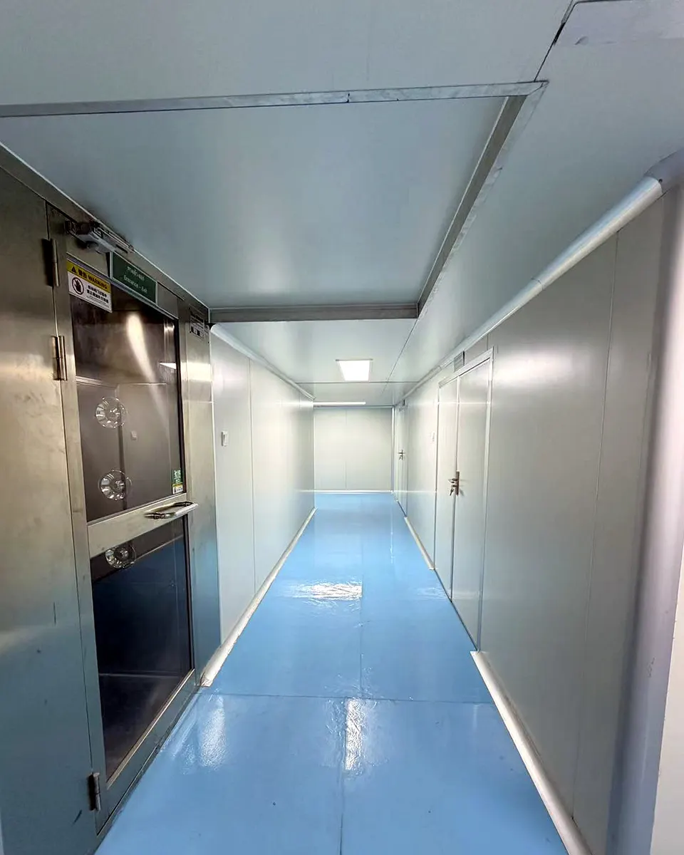 Corridor leading to a stainless-steel airlock inside Sawatdee Group’s factory in Samut Prakan, Thailand.