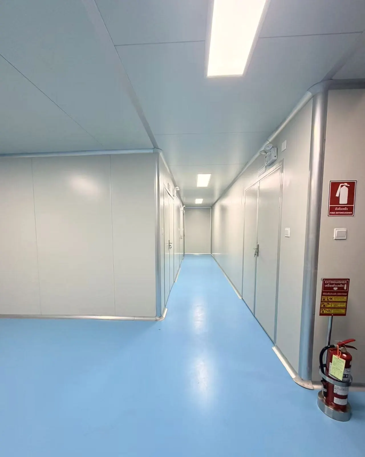 Controlled corridor with fire-safety equipment at Sawatdee Group’s factory in Samut Prakan, Thailand.